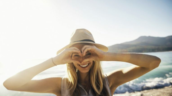 The power of positive thinking is shown by this smiling woman.